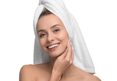 Photo of Smiling woman removing makeup with cotton pad on white background