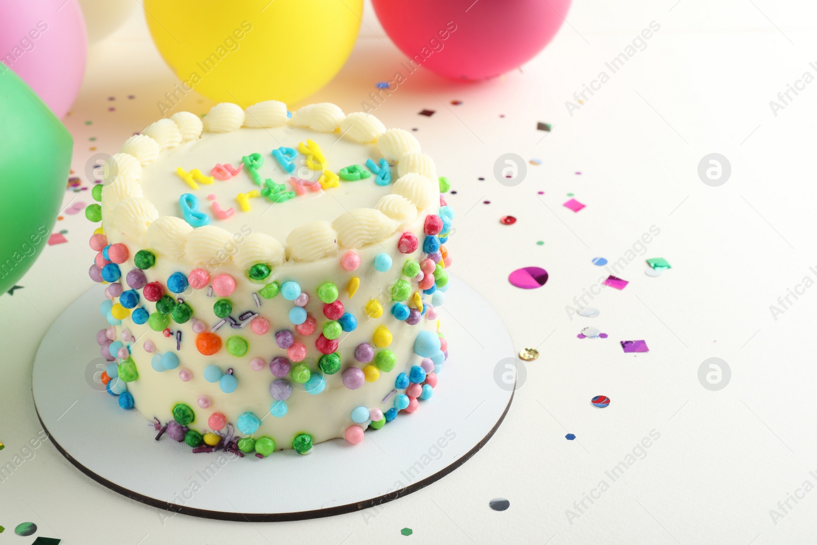 Photo of Cute bento cake with tasty cream and decor on white background