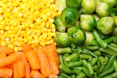 Photo of Mix of frozen vegetables as background, top view