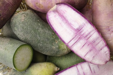 Photo of Purple and green daikon radishes as background, top view