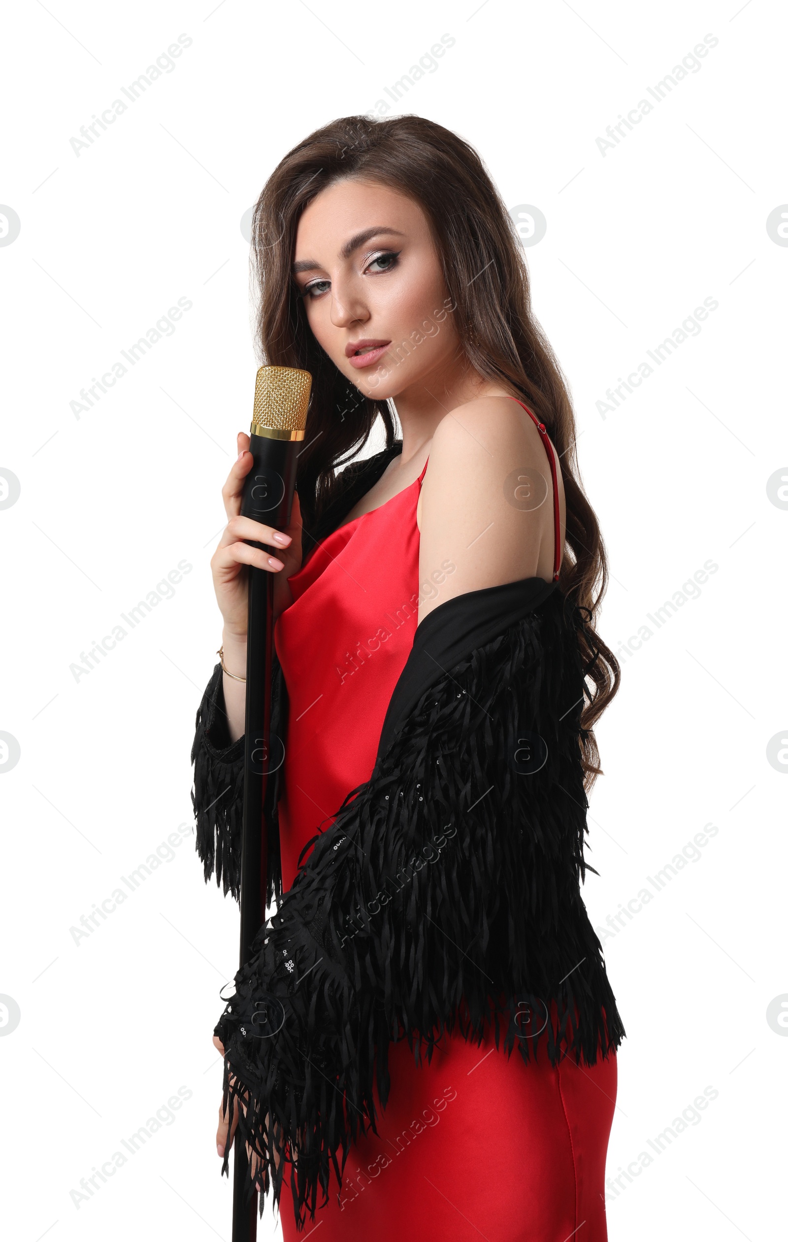 Photo of Beautiful young woman in stylish dress with microphone singing on white background