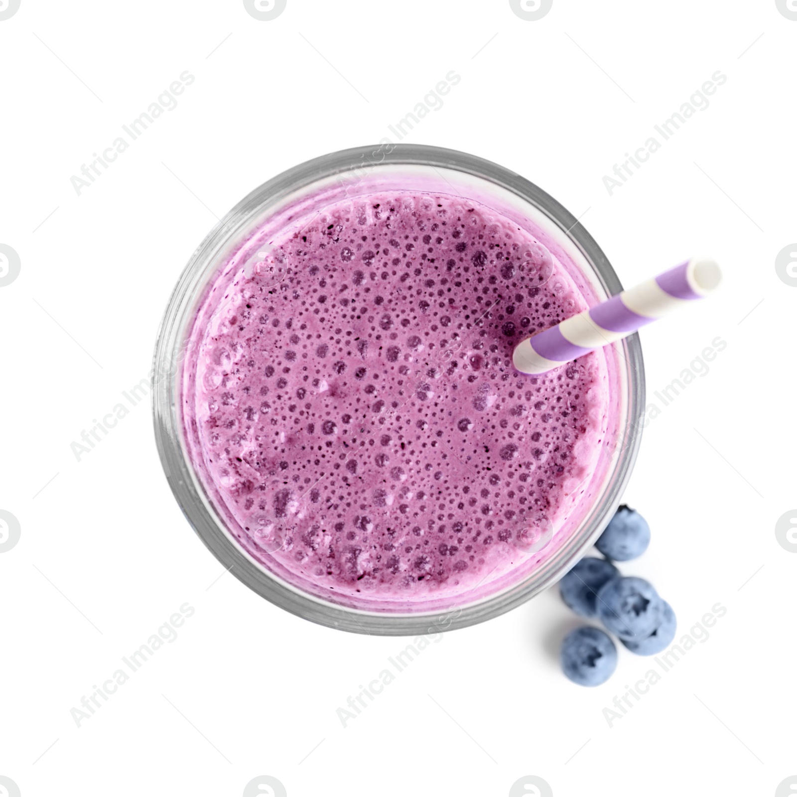 Photo of Tasty blueberry smoothie in glass on white background, top view