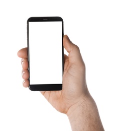 Photo of Man holding smartphone with blank screen on white background, closeup of hand. Space for text