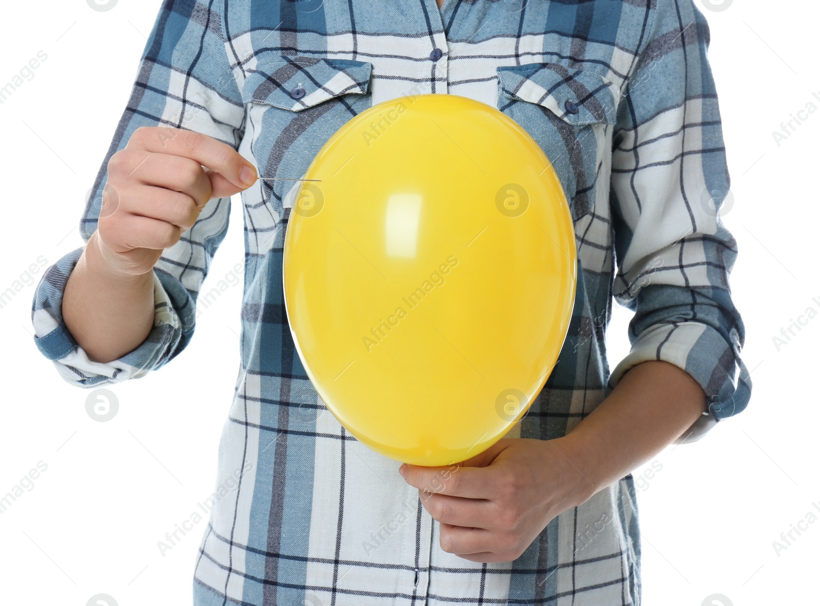 Photo of Woman piercing yellow balloon on white background, closeup