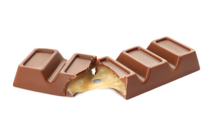 Pieces of delicious chocolate bar on white background