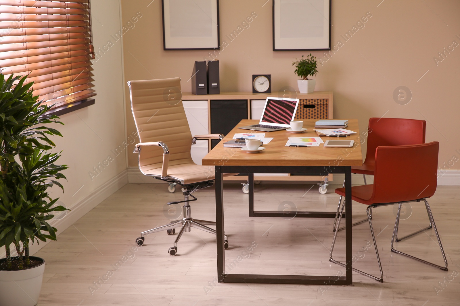 Photo of Director's office with large wooden table. Interior design