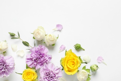 Photo of Flat lay composition with beautiful blooming flowers on white background