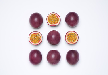 Photo of Fresh ripe passion fruits (maracuyas) on white background, flat lay