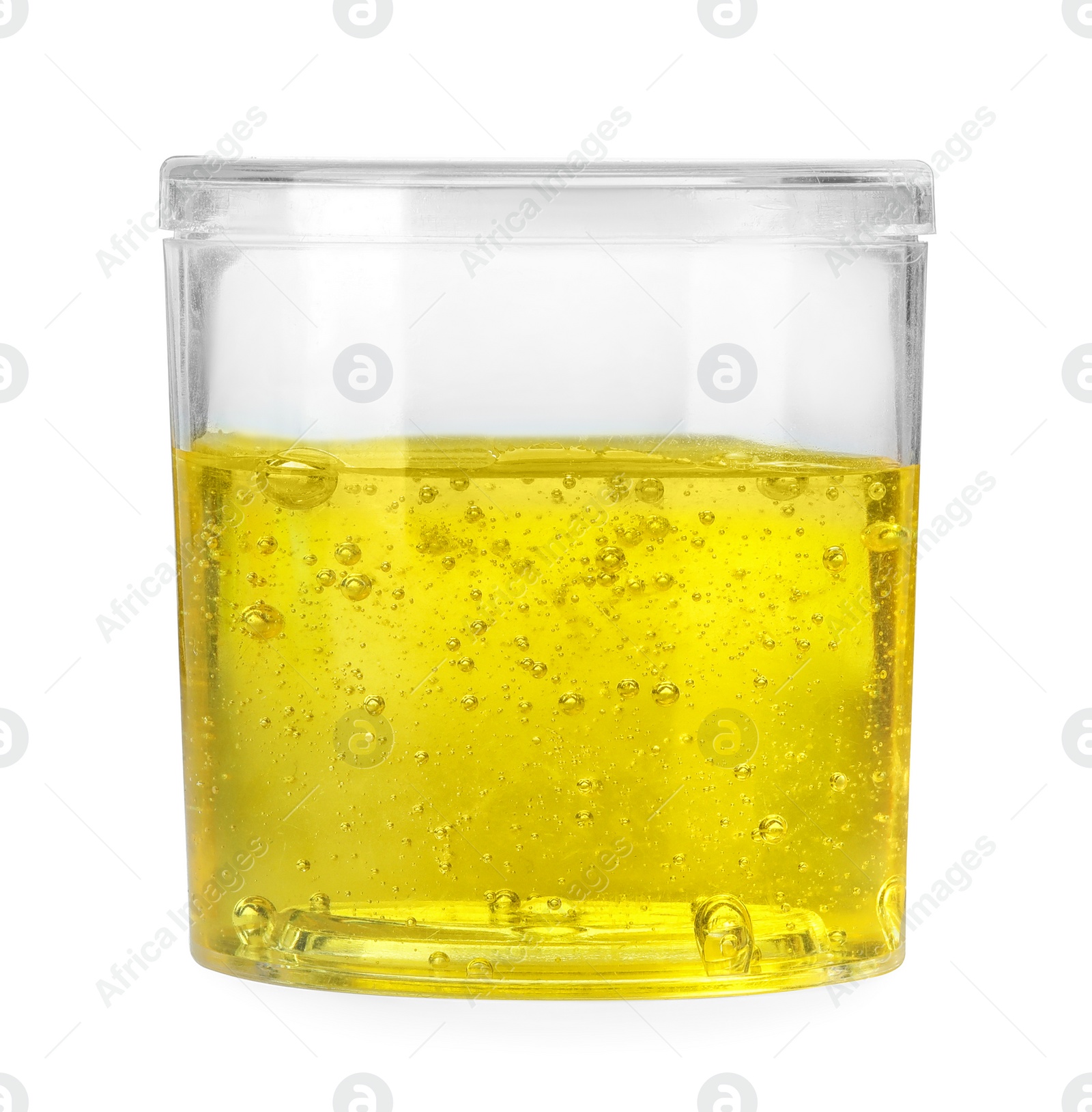 Photo of Yellow slime in plastic container isolated on white. Antistress toy