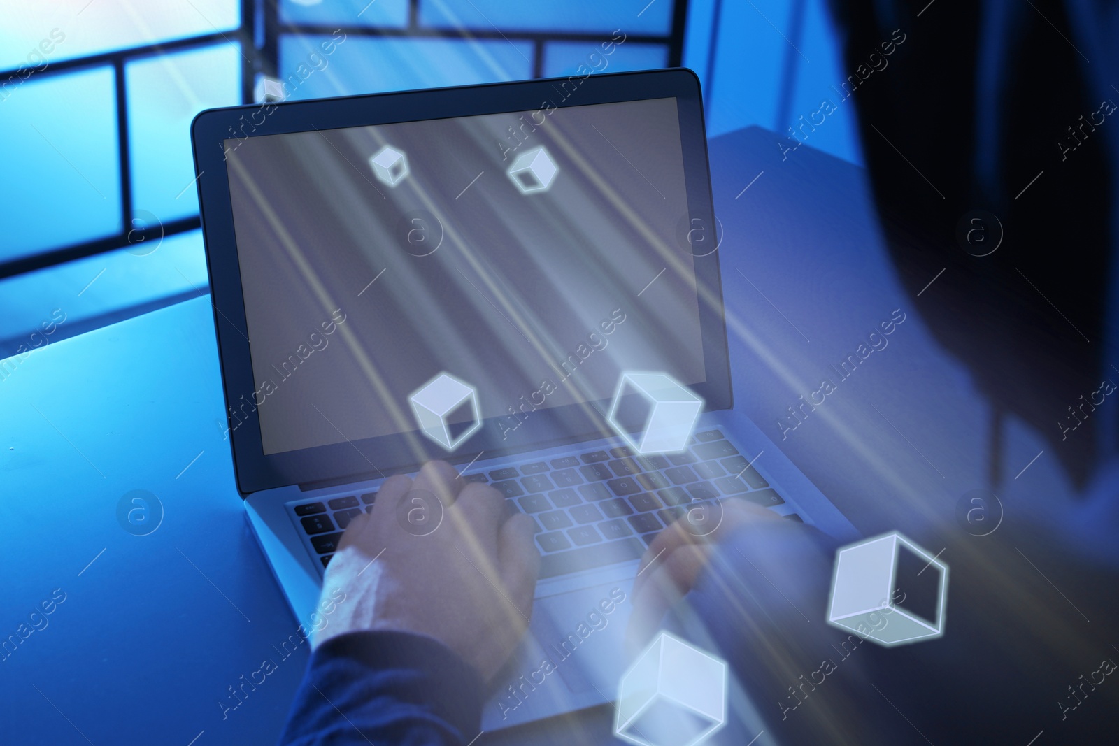 Image of Speed internet. Man using laptop at table in dark room, closeup. Motion blur effect symbolizing fast connection