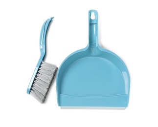 Plastic hand broom and dustpan on white background, top view