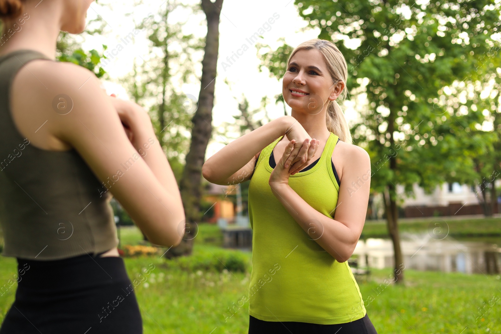 Photo of Women doing morning exercise together in park