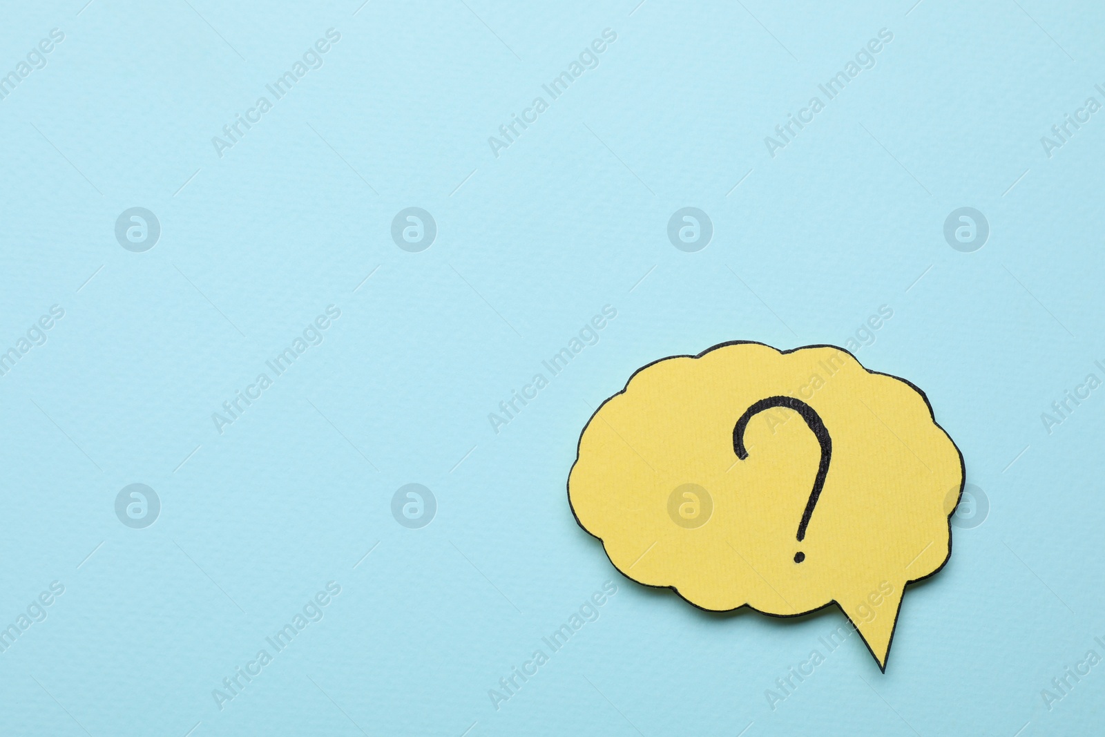 Photo of Paper speech bubble with question mark on light blue background, top view. Space for text