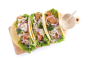 Photo of Yummy fish tacos with sauce isolated on white, top view