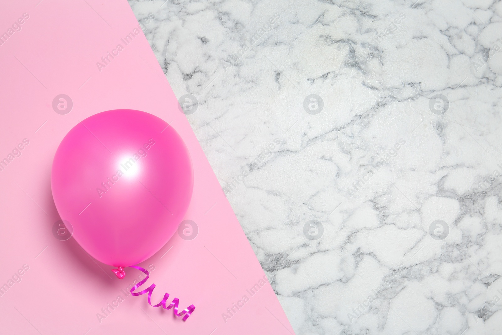 Photo of Bright balloon on colorful background, top view with space for text. Party time