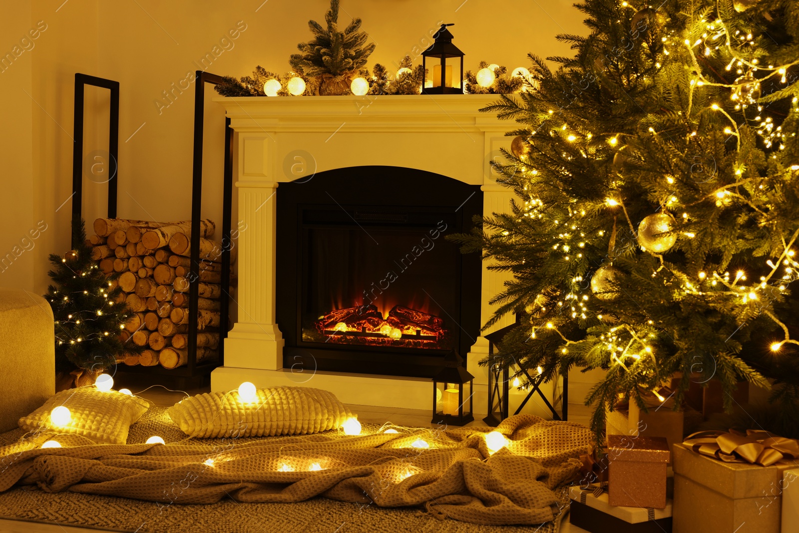 Photo of Beautiful living room interior with burning fireplace and Christmas tree in evening