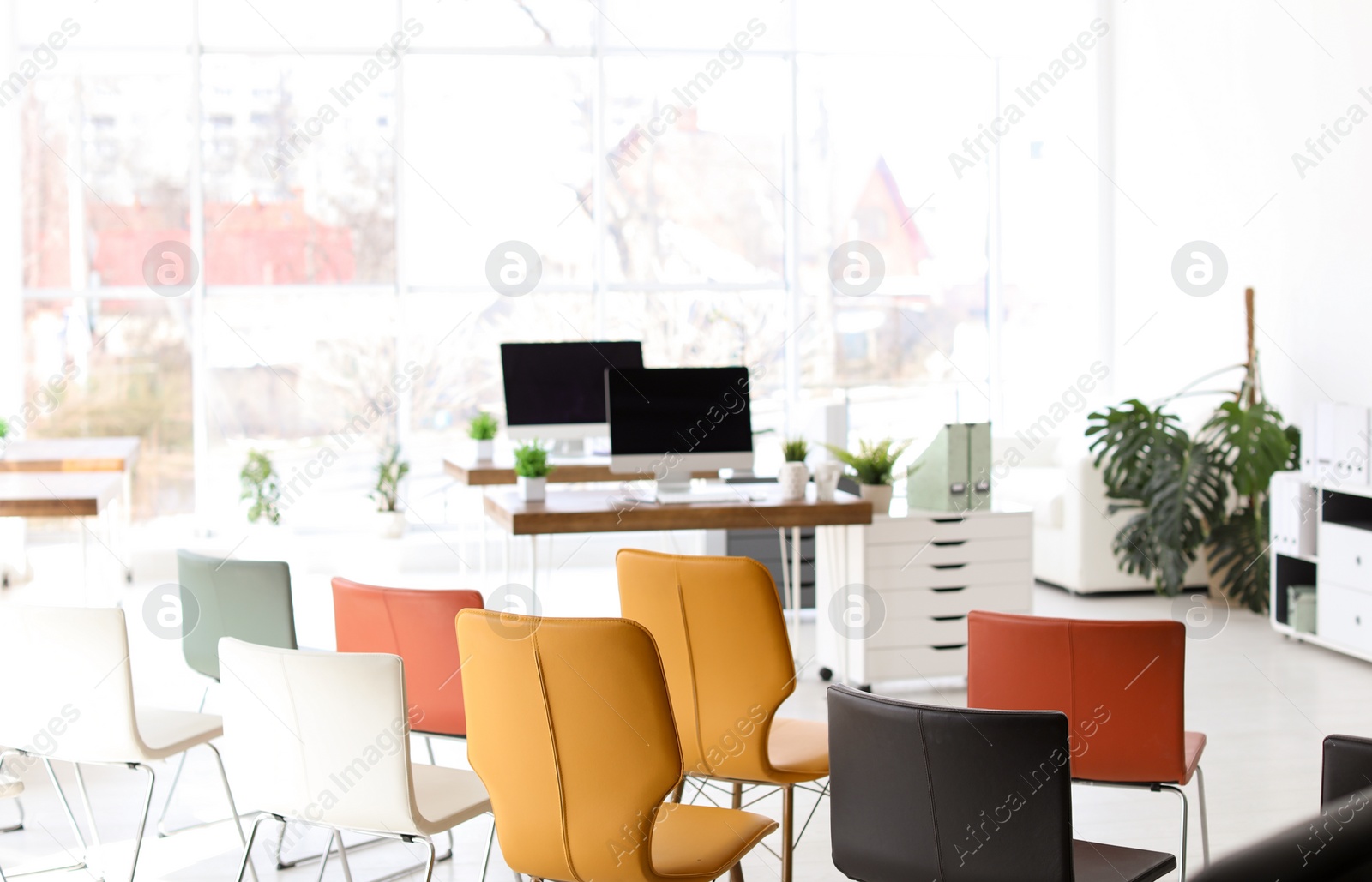 Photo of Office interior with many comfortable chairs. Business training