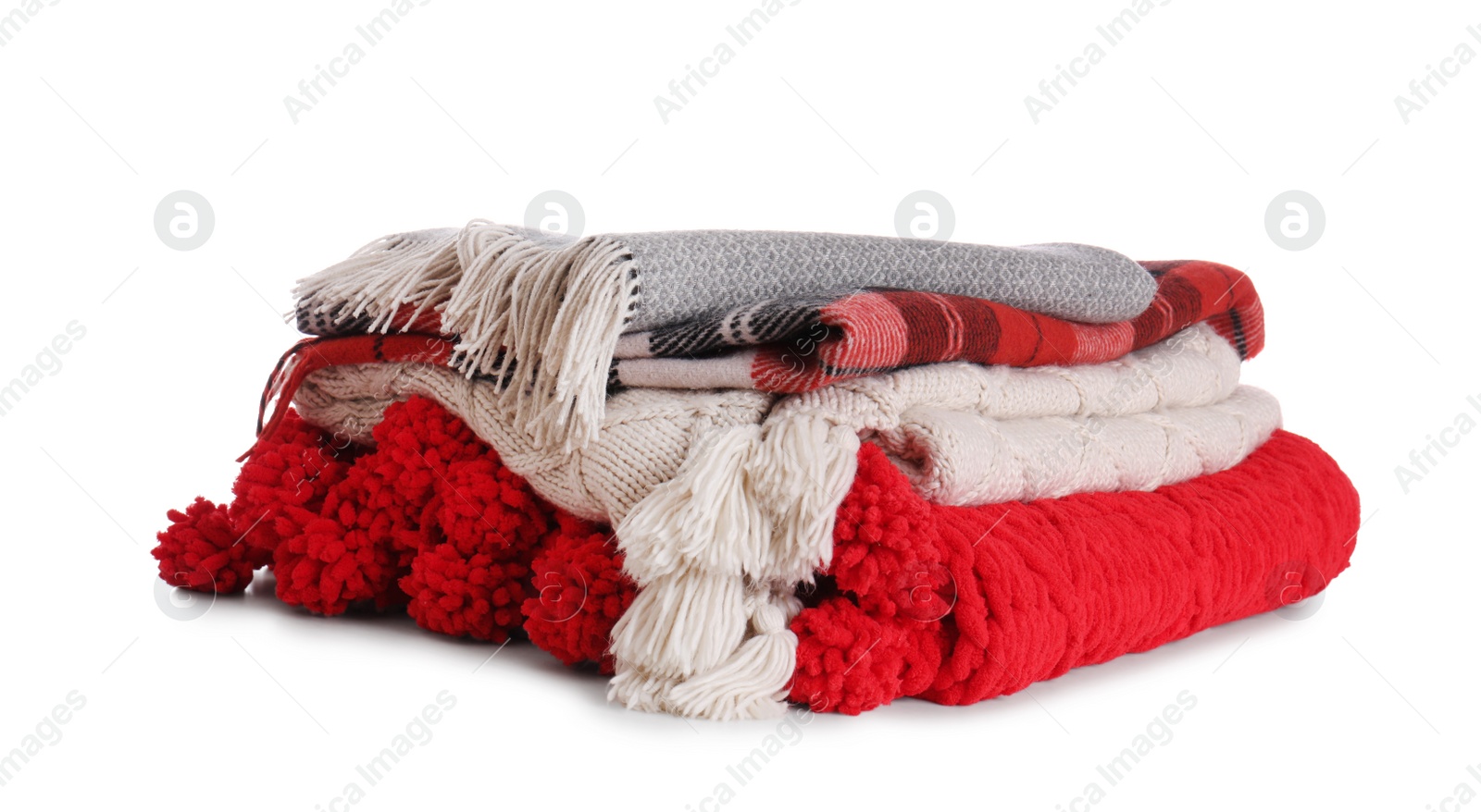 Photo of Stack of folded warm plaids on white background