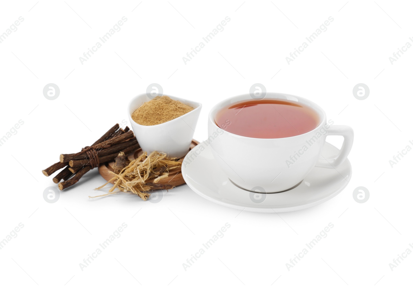 Photo of Aromatic licorice tea in cup, dried sticks of licorice root and powder isolated on white