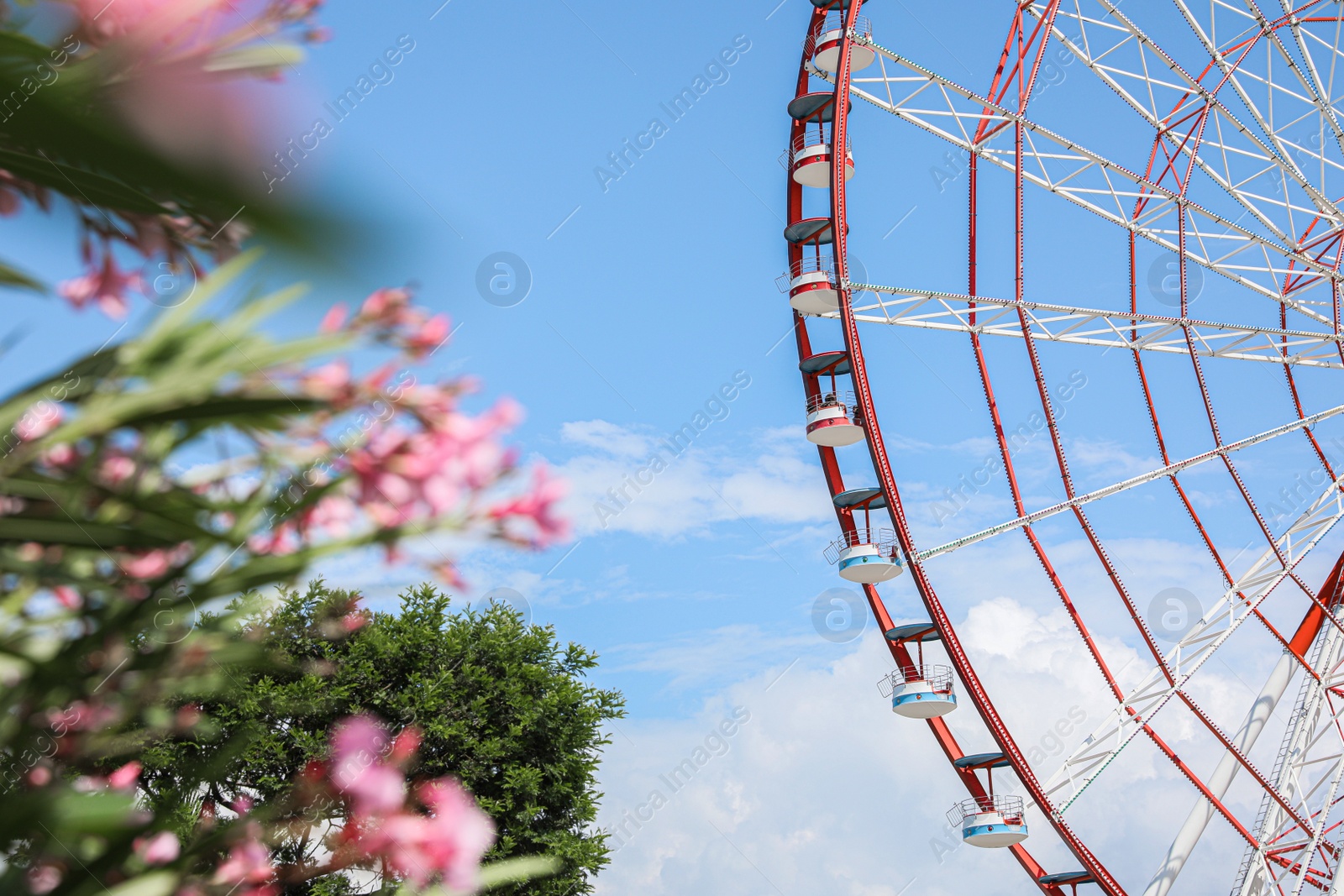 Photo of Beautiful large Ferris wheel outdoors on sunny day