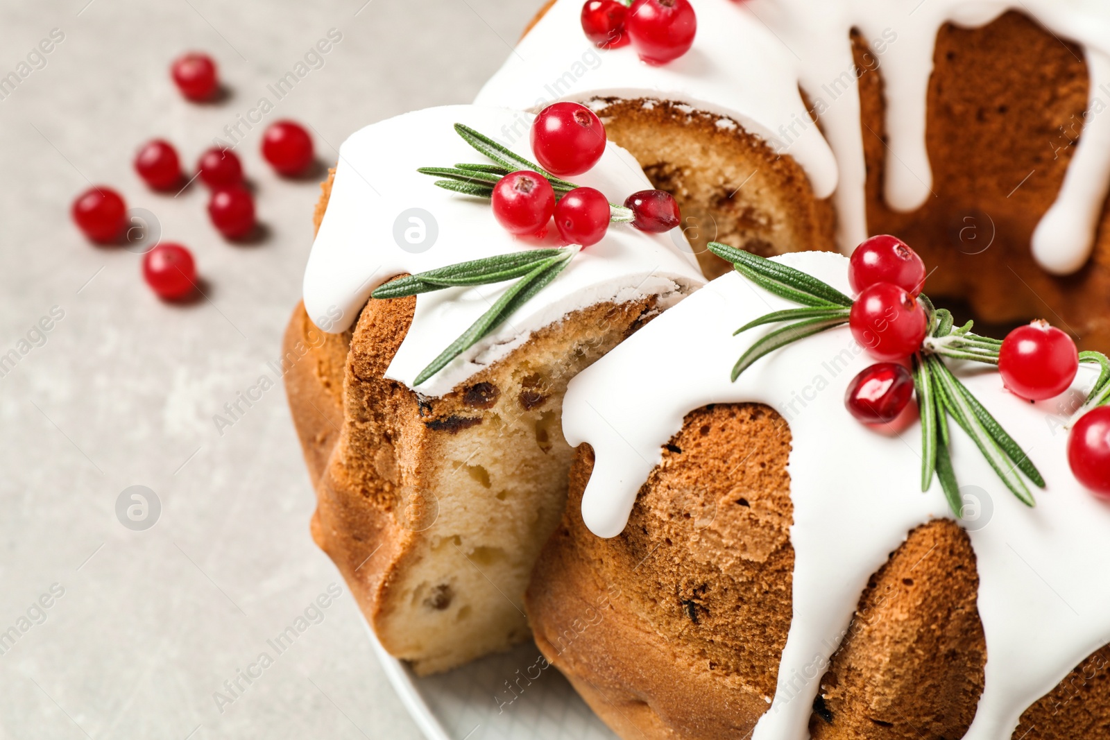 Photo of Traditional homemade Christmas cake on light grey table, closeup