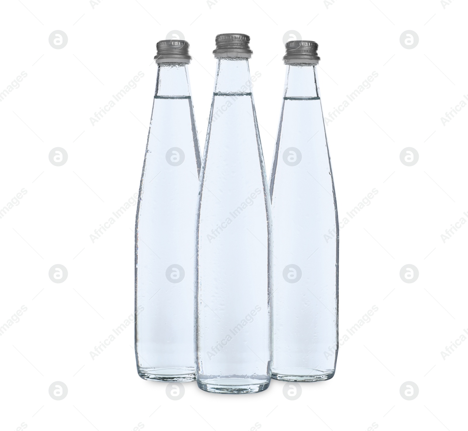 Photo of Glass bottles with soda water on white background