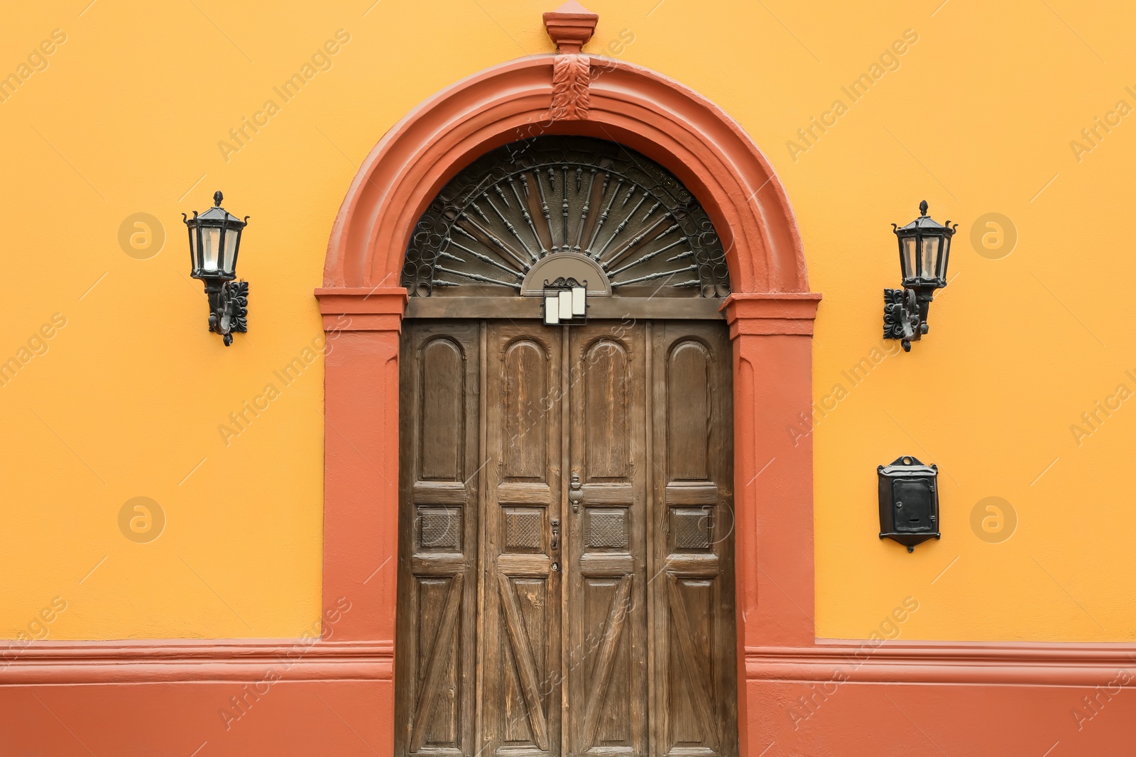 Photo of Entrance of residential house with wooden door