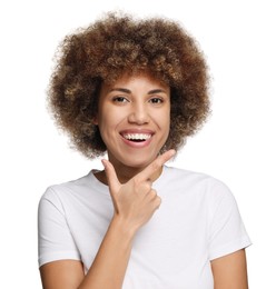 Photo of Woman showing her clean teeth and smiling on white background