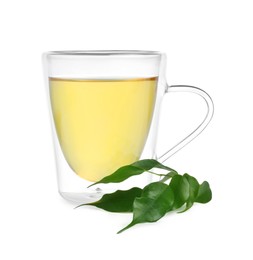 Fresh green tea in glass mug and leaves isolated on white