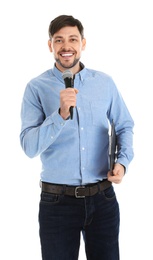 Handsome man with microphone and clipboard on white background