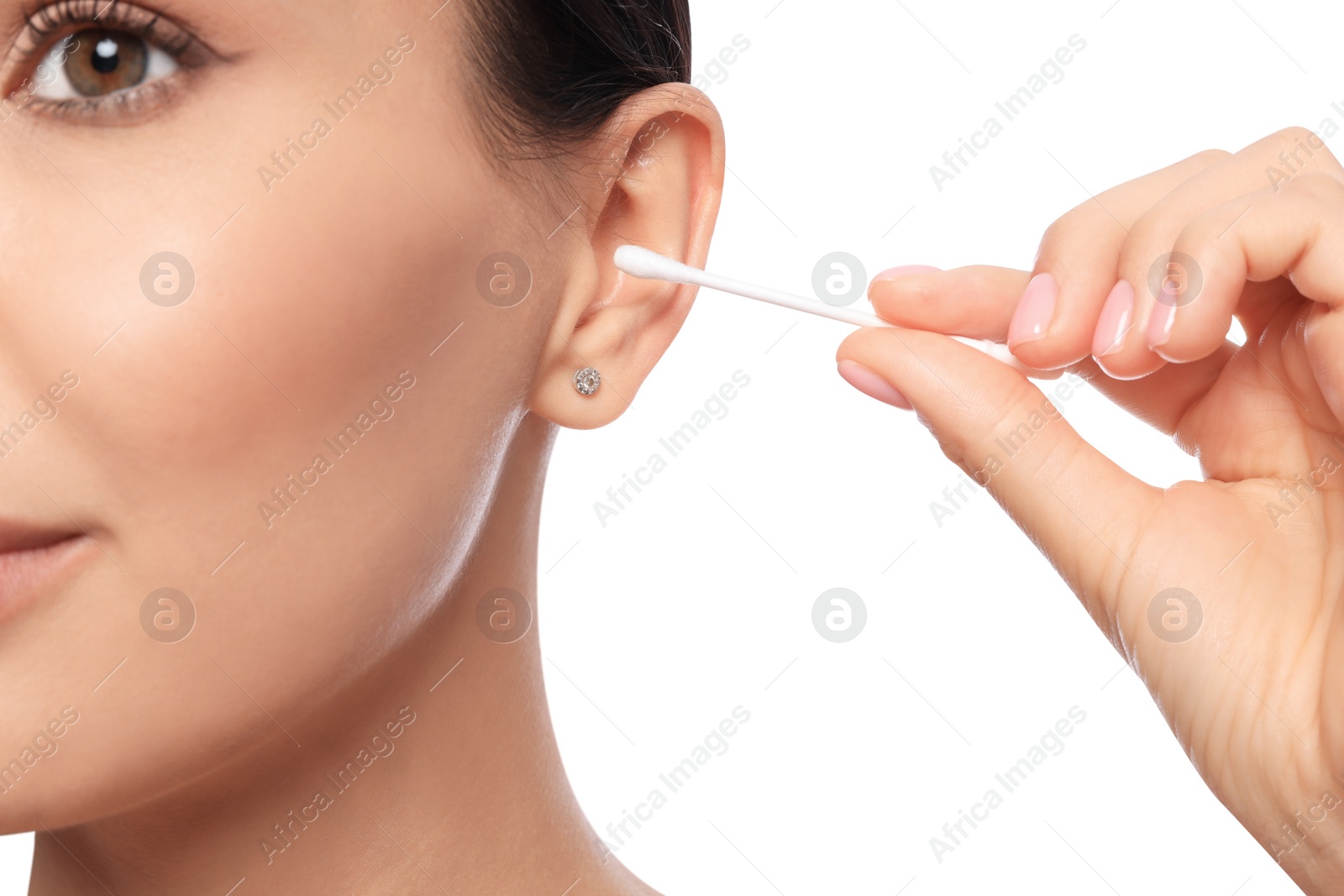 Photo of Young woman cleaning ear with cotton swab on white background, closeup