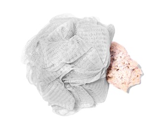 Photo of New grey shower puff with seashell on white background, top view. Personal hygiene