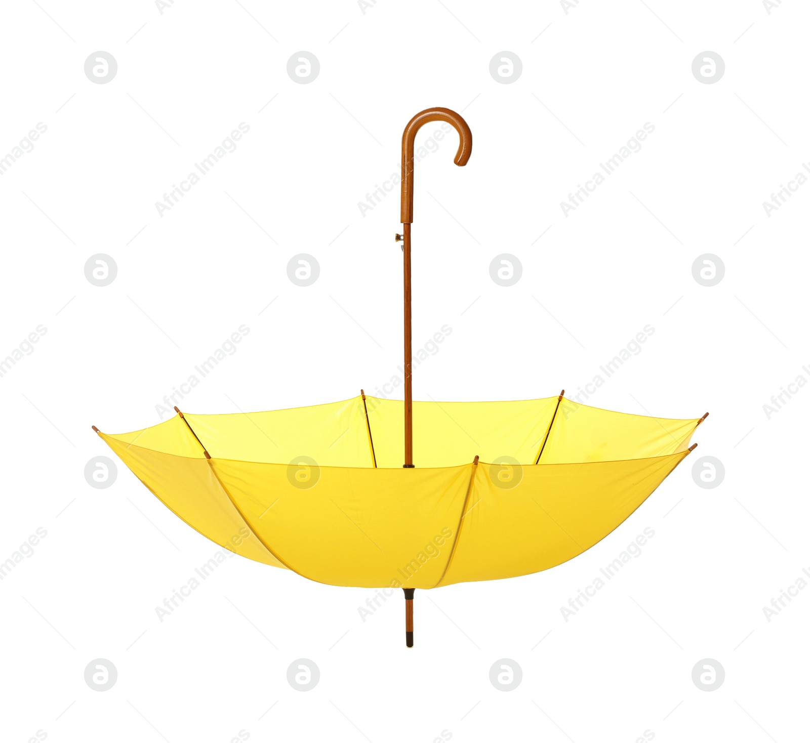 Photo of Modern opened yellow umbrella isolated on white