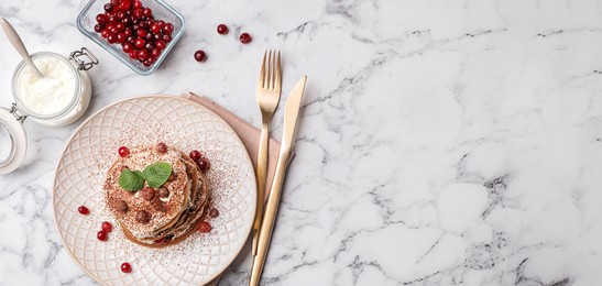 Flat lay composition with delicious pancakes on table, space for text. Banner design