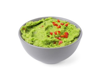 Photo of Bowl of delicious guacamole isolated on white