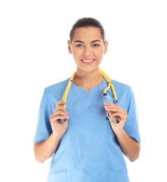 Photo of Portrait of young medical assistant with stethoscope on white background