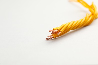 Closeup view of electrical power cables on white background, space for text