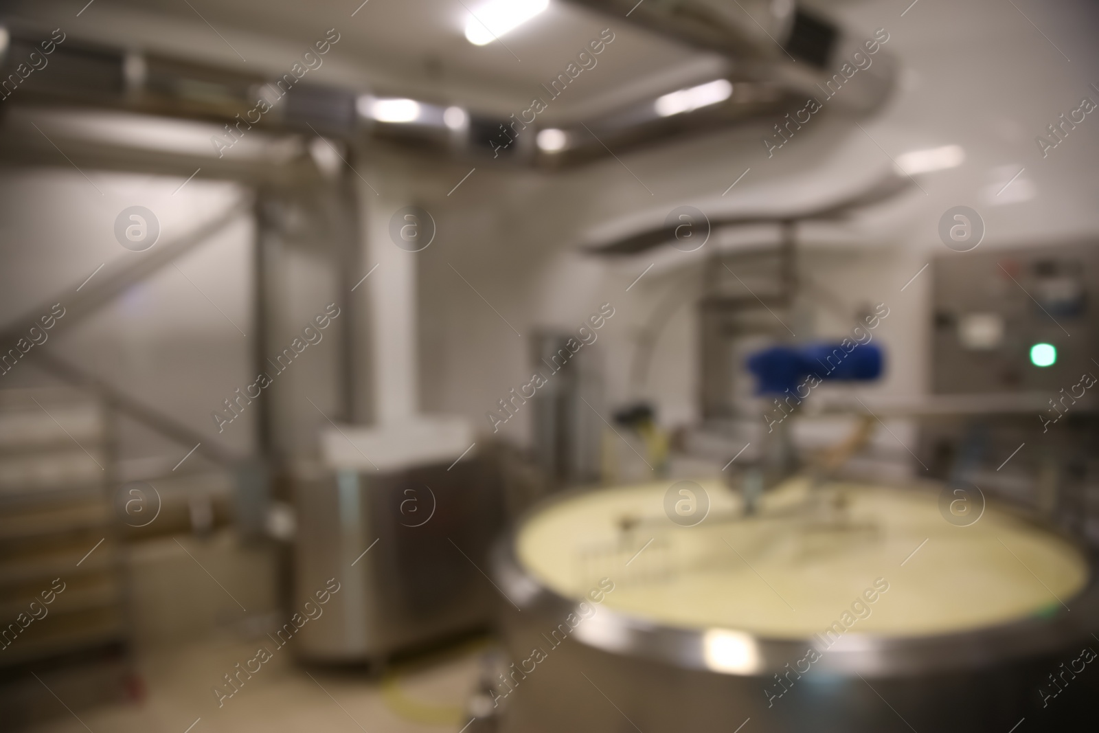 Photo of Blurred view of curd preparation tank at cheese factory