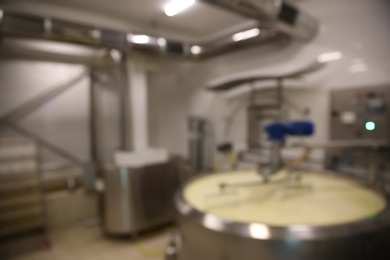 Blurred view of curd preparation tank at cheese factory