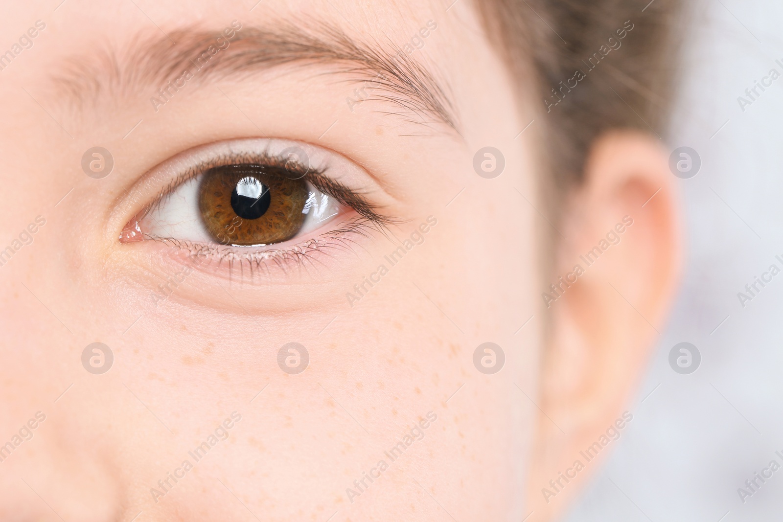 Photo of Little girl, focus on eye. Visiting children's doctor and ophthalmologist