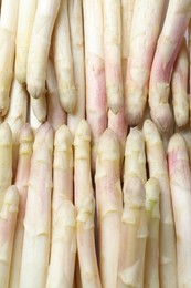Photo of Fresh ripe white asparagus as background, top view