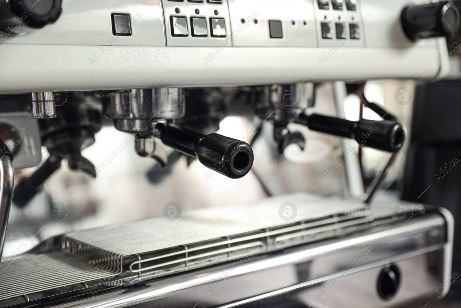 Photo of Modern coffee machine with portafilters, closeup view