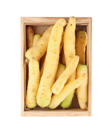 Photo of Fresh raw carrots in wooden crate isolated on white, top view