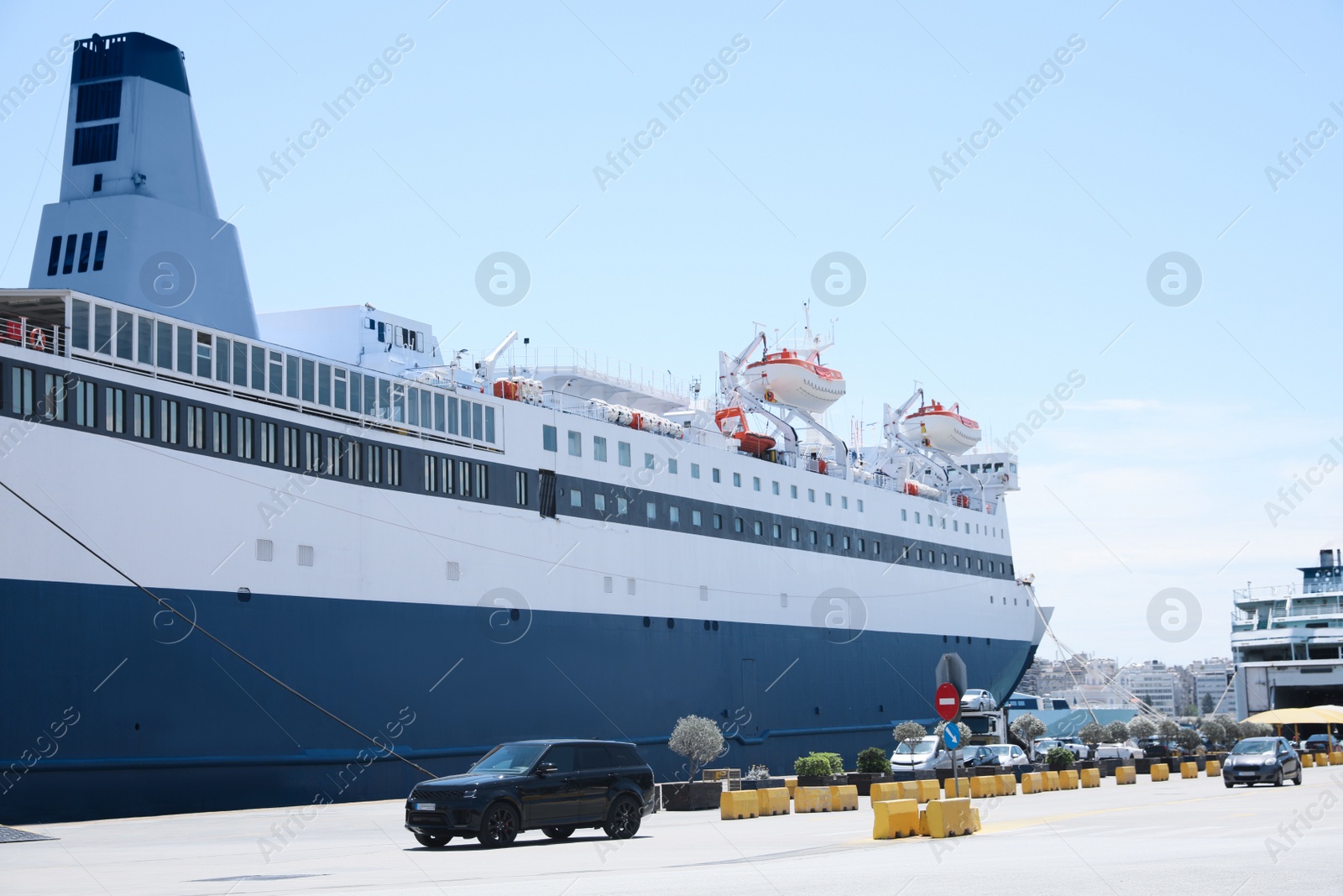 Photo of PIRAEUS, GREECE - MAY 19, 2022: Picturesque view of port with Blue Star ferry on sunny day