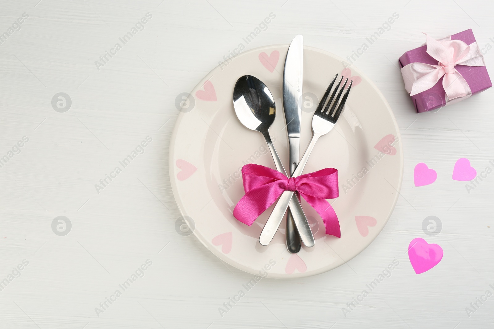 Photo of Beautiful table setting on white wooden background, flat lay with space for text. Valentine's Day dinner