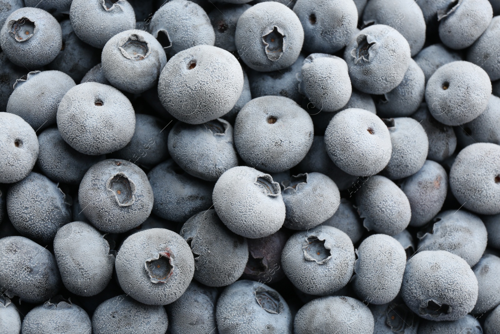 Photo of Tasty frozen blueberries as background, top view