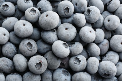 Photo of Tasty frozen blueberries as background, top view