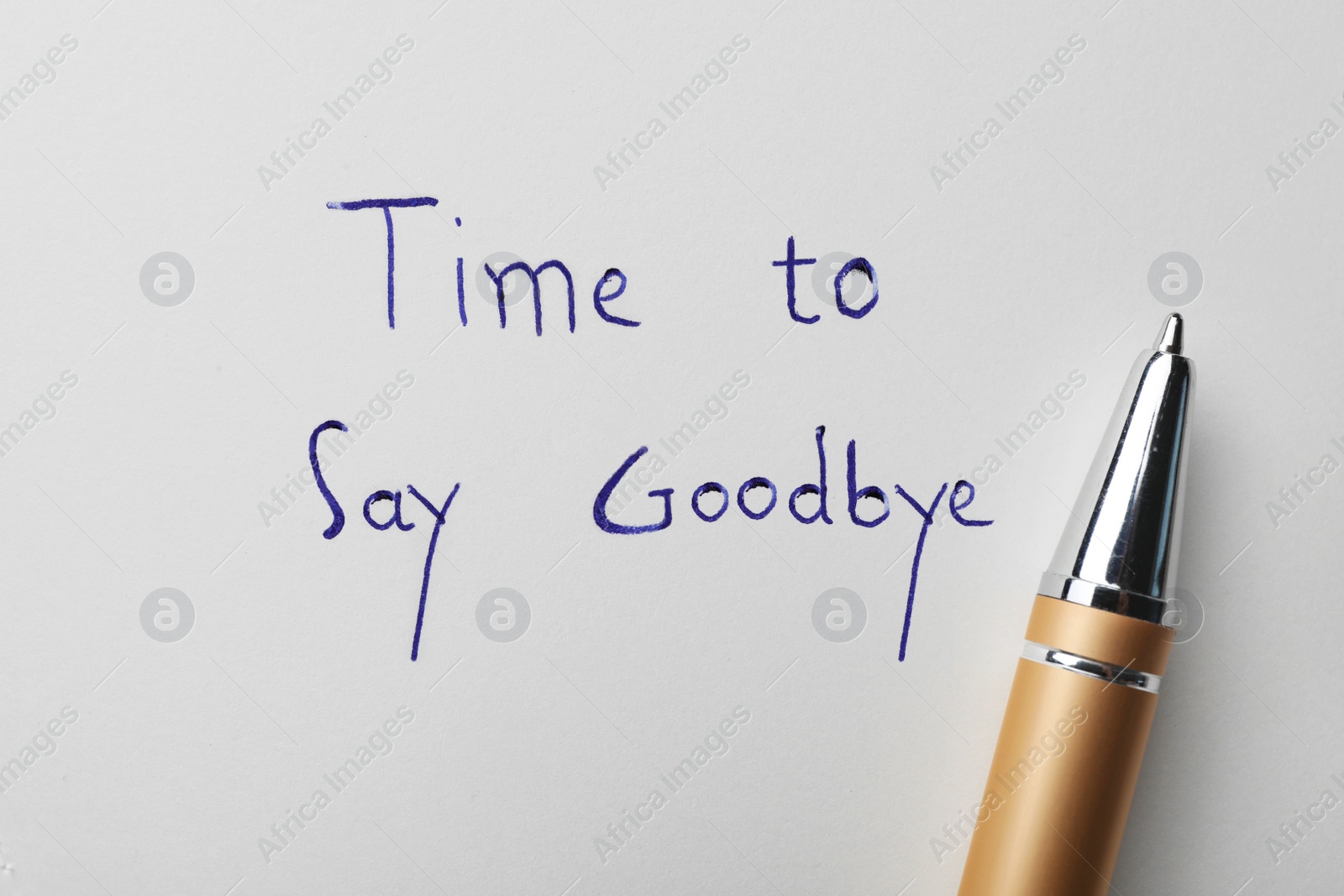 Image of Pen and phrase Time to say Goodbye written on white paper, top view