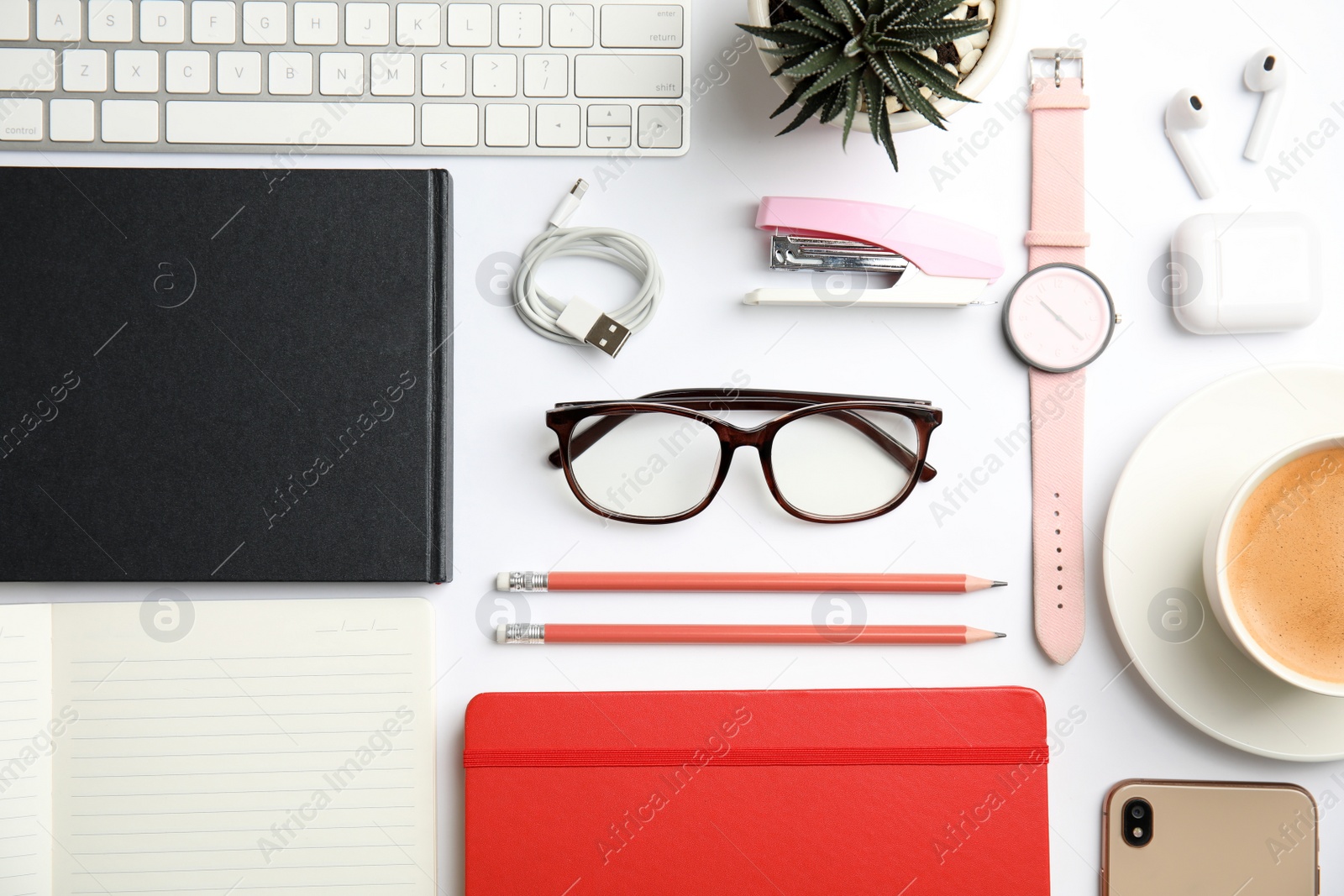 Photo of Flat lay composition with eyeglasses and office stationery on white background