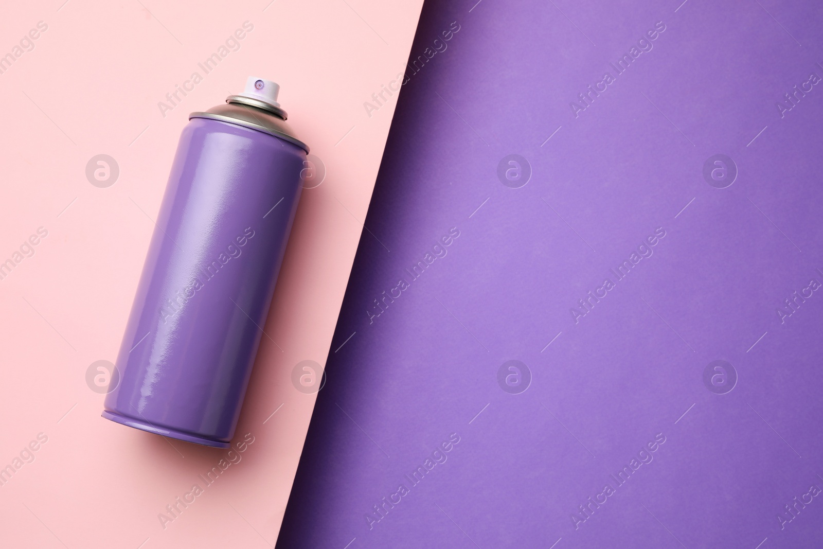 Photo of Can of spray paint on color background, top view with space for text. Graffiti supply